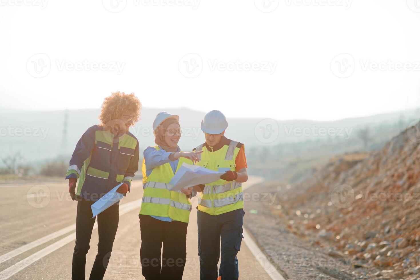 A team of engineers and workers oversees a wind turbine project at a modern wind farm, working together to ensure the efficient generation of renewable energy photo