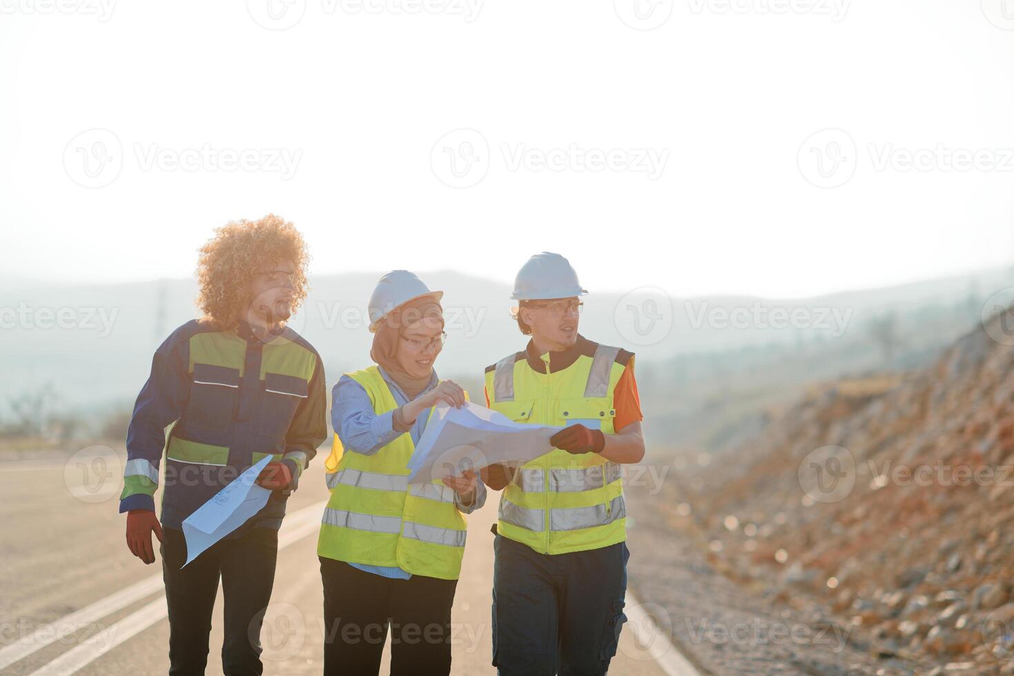 A team of engineers and workers oversees a wind turbine project at a modern wind farm, working together to ensure the efficient generation of renewable energy photo