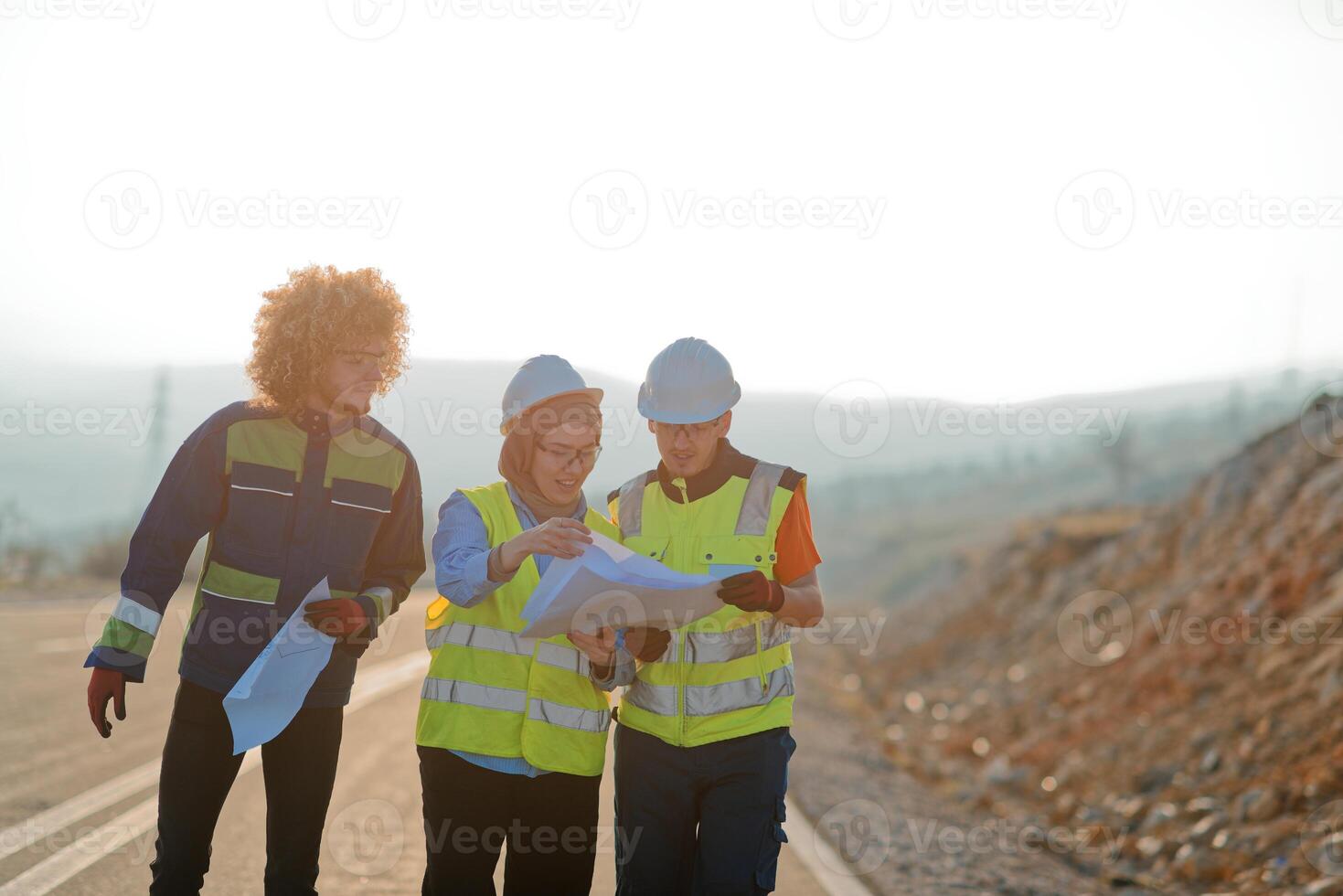 A team of engineers and workers oversees a wind turbine project at a modern wind farm, working together to ensure the efficient generation of renewable energy photo