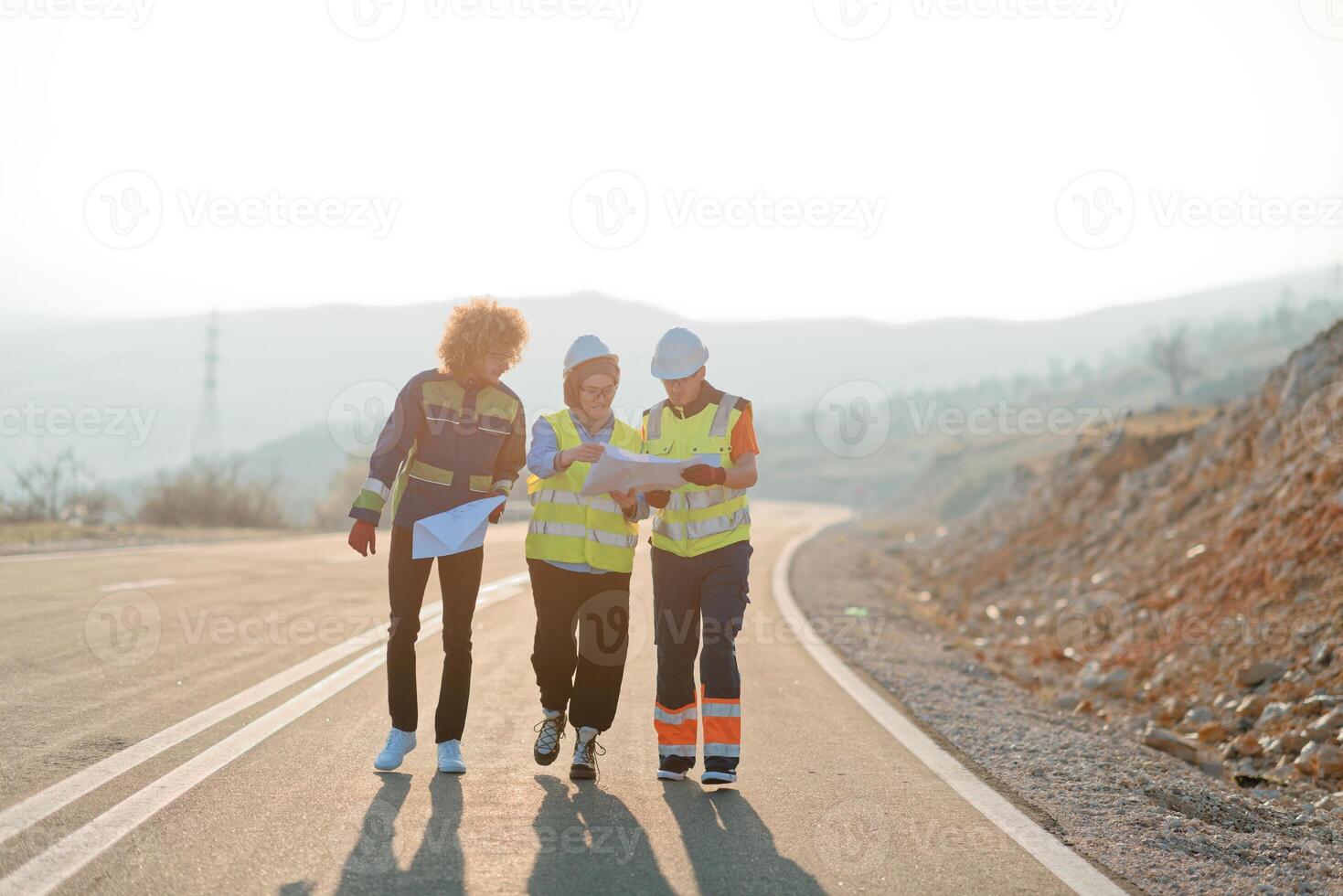 A team of engineers and workers oversees a wind turbine project at a modern wind farm, working together to ensure the efficient generation of renewable energy photo