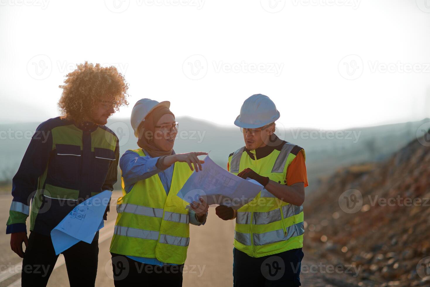 A team of engineers and workers oversees a wind turbine project at a modern wind farm, working together to ensure the efficient generation of renewable energy photo