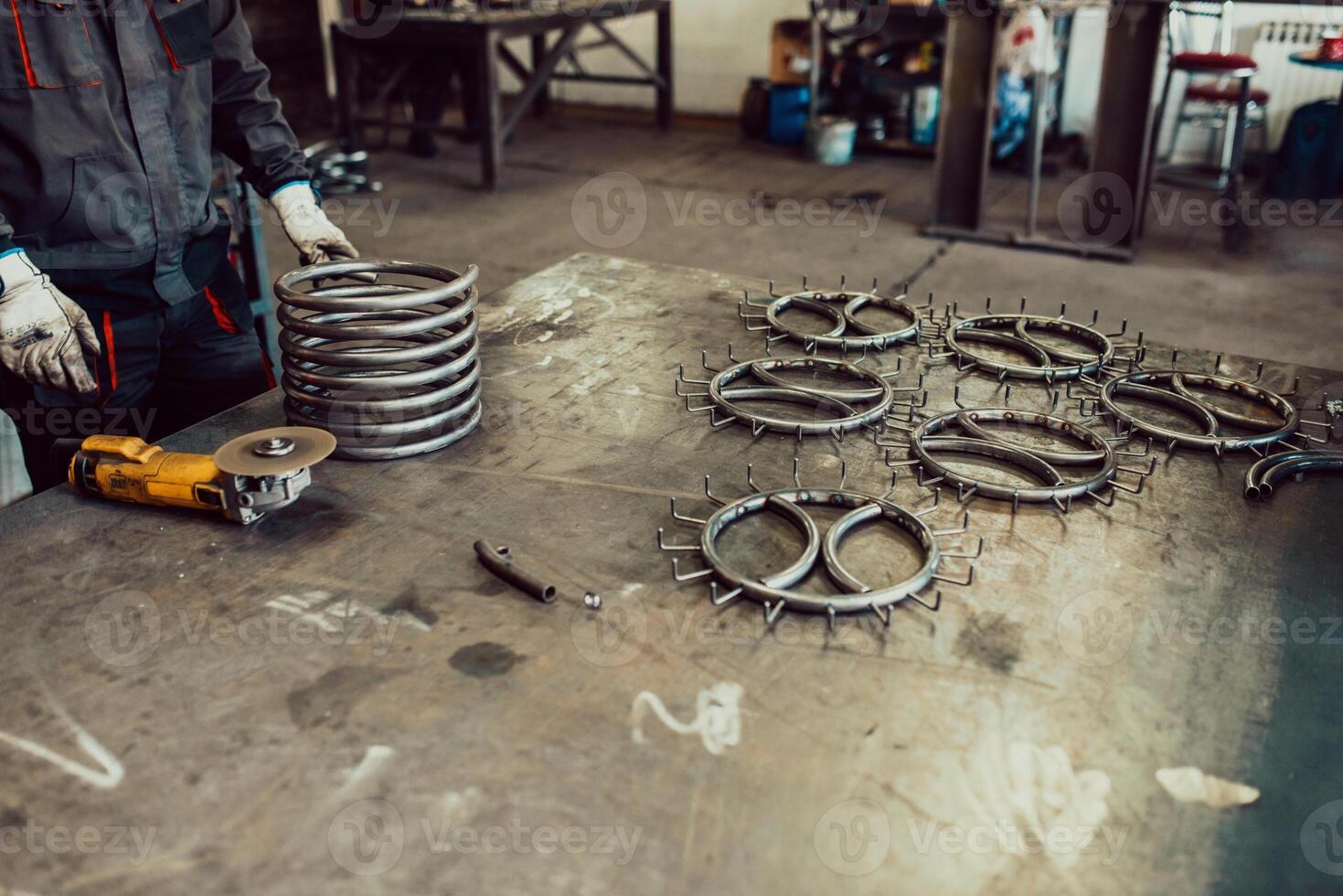 Pieces of steel lined up on the table ready for the welding process photo