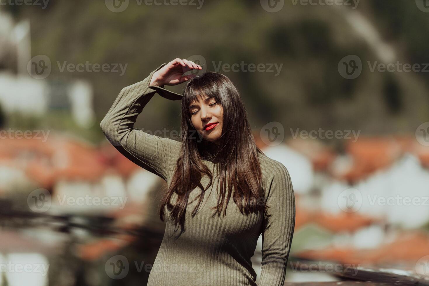 A confident and stylish plus-size woman walking by a modern building in an olive green dress, radiating beauty, empowerment, and self-love. photo