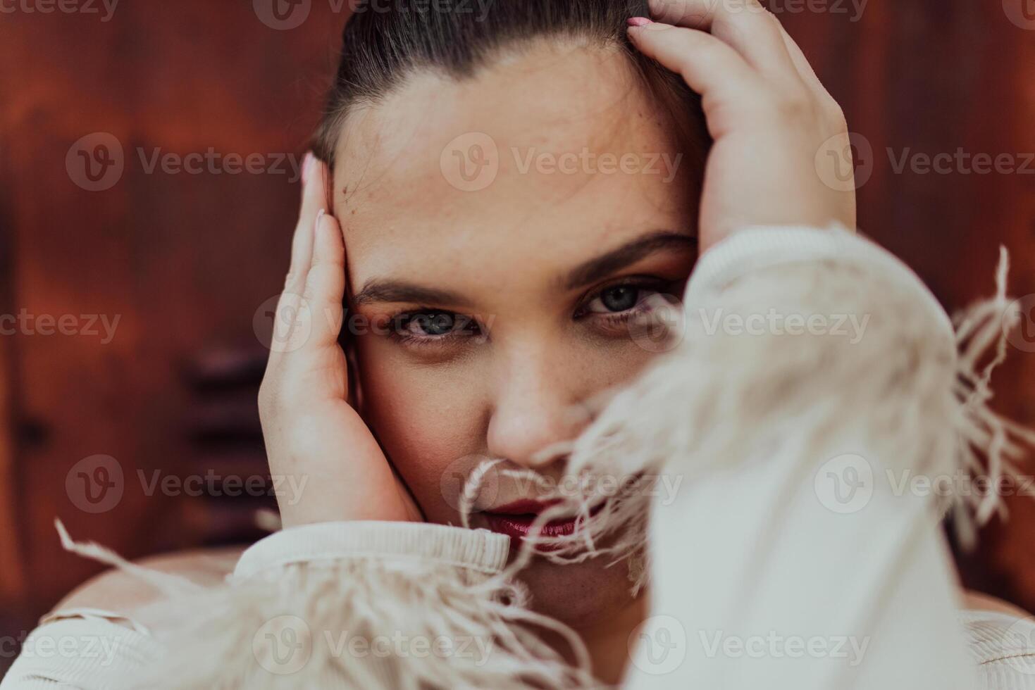 A close-up, unretouched portrait of a naturally beautiful young woman showcasing her authentic and unaltered facial features, capturing the essence of real beauty without any digital enhancements. photo