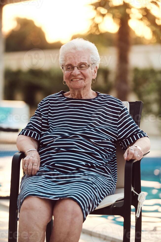 Unfiltered portrait, a real elderly woman sits gracefully in a chair, showcasing the authenticity of aging with wrinkles and a natural face photo