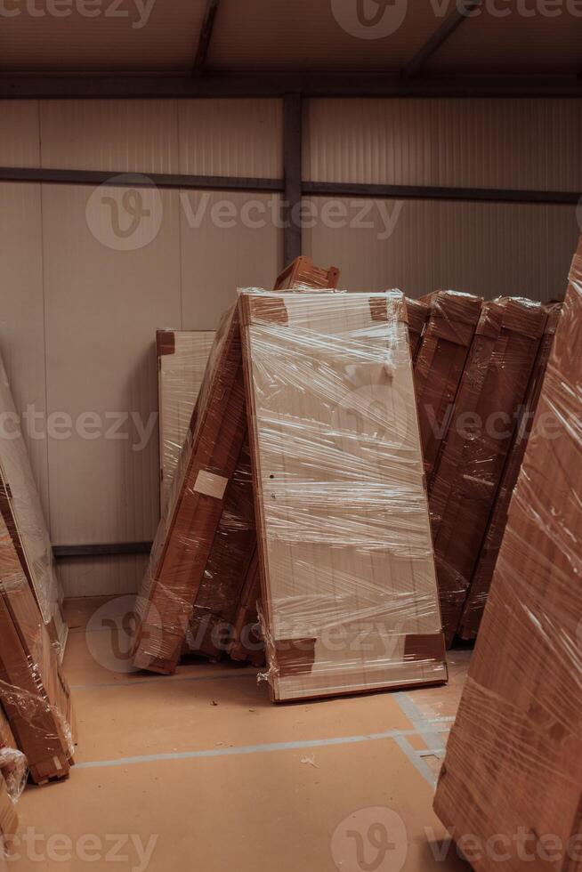 A vast warehouse in the forestry industry, showcasing a plethora of wooden products, including boards and various timber items neatly organized in storage photo