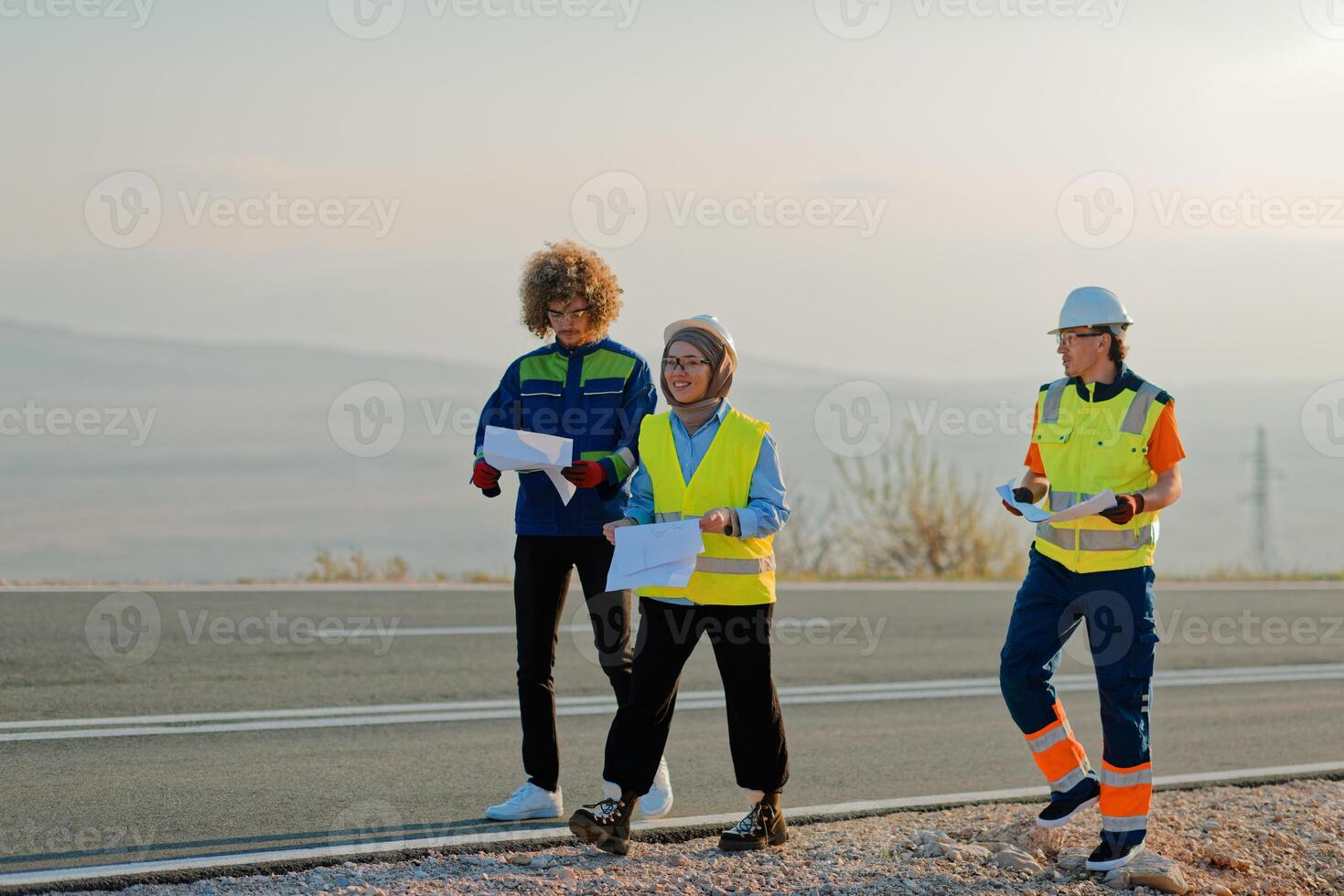 A team of engineers and workers oversees a wind turbine project at a modern wind farm, working together to ensure the efficient generation of renewable energy photo