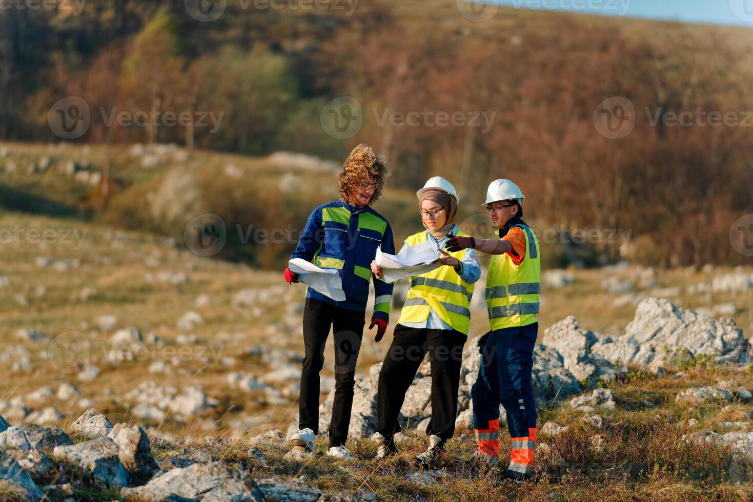 A team of engineers and workers oversees a wind turbine project at a modern wind farm, working together to ensure the efficient generation of renewable energy photo