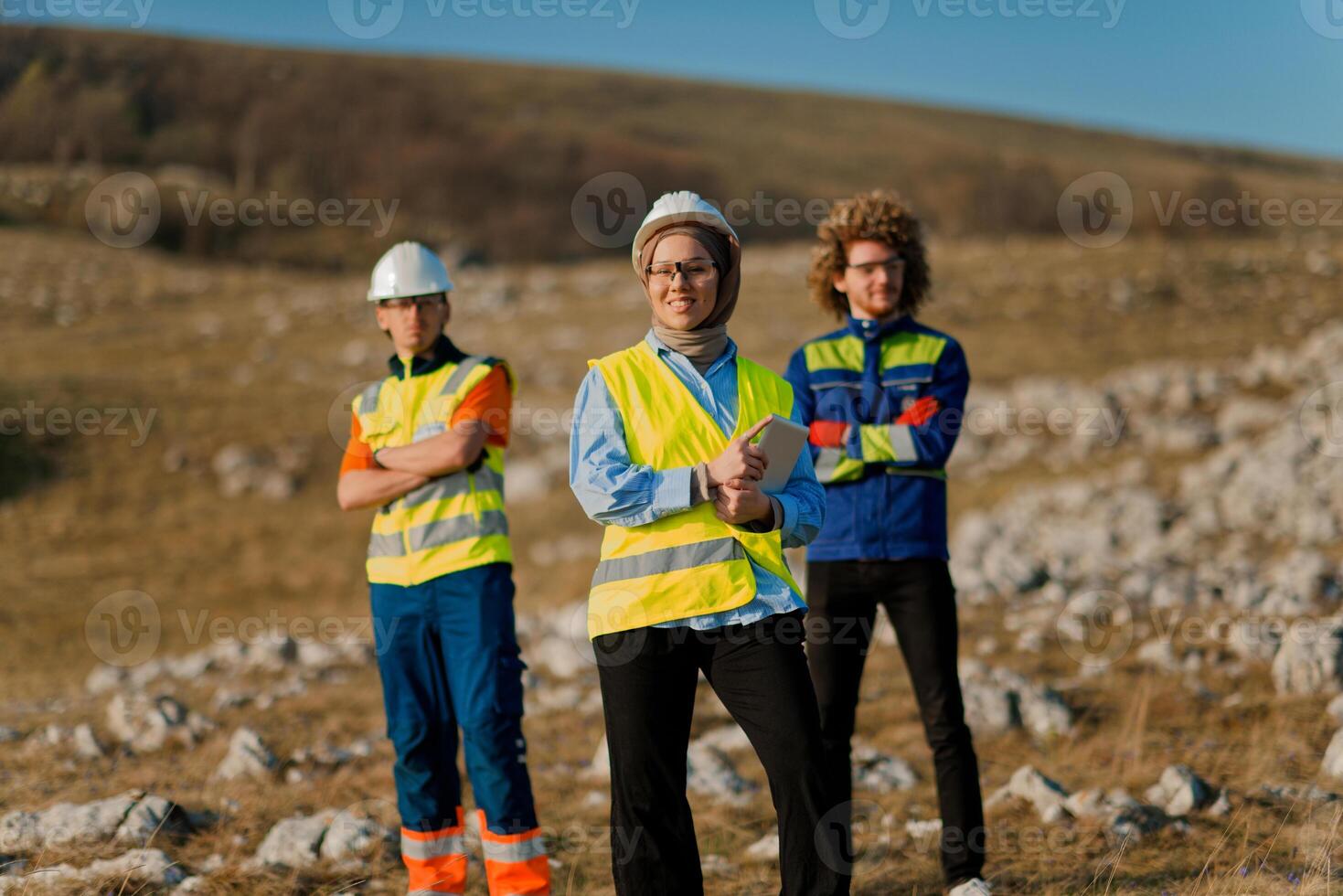 A team of engineers and workers oversees a wind turbine project at a modern wind farm, working together to ensure the efficient generation of renewable energy photo