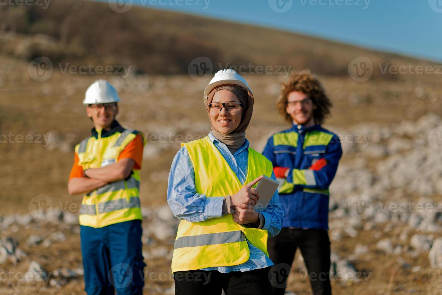 A team of engineers and workers oversees a wind turbine project at a modern wind farm, working together to ensure the efficient generation of renewable energy photo