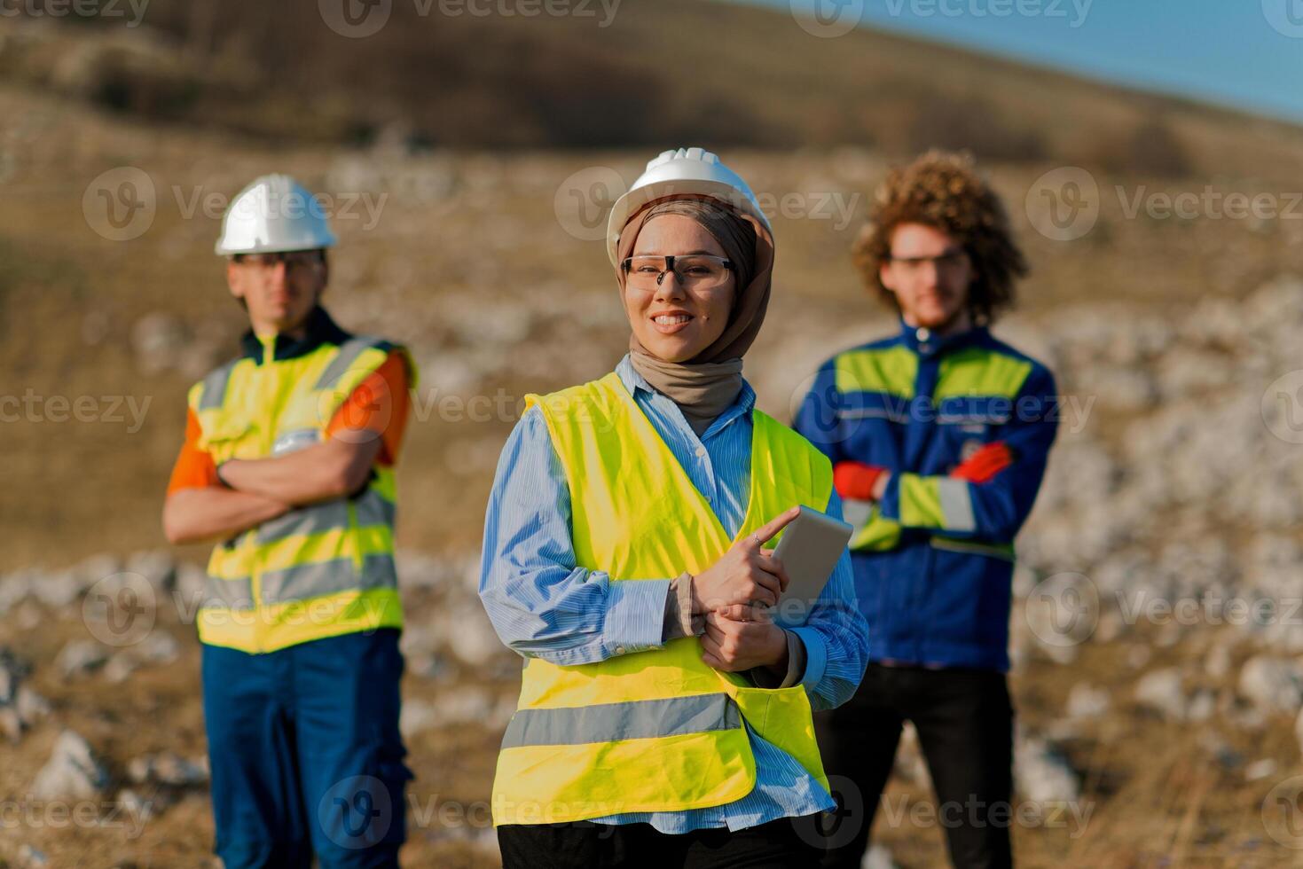 A team of engineers and workers oversees a wind turbine project at a modern wind farm, working together to ensure the efficient generation of renewable energy photo