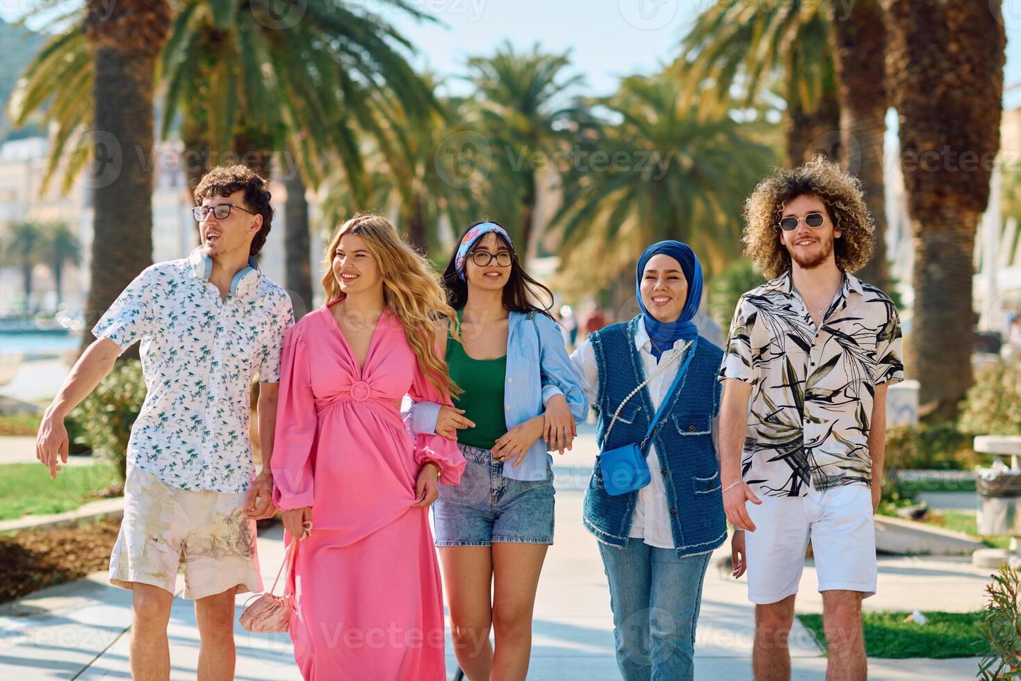 A diverse group of tourists, dressed in summer attire, strolls through the tourist city with wide smiles, enjoying their sightseeing adventure photo