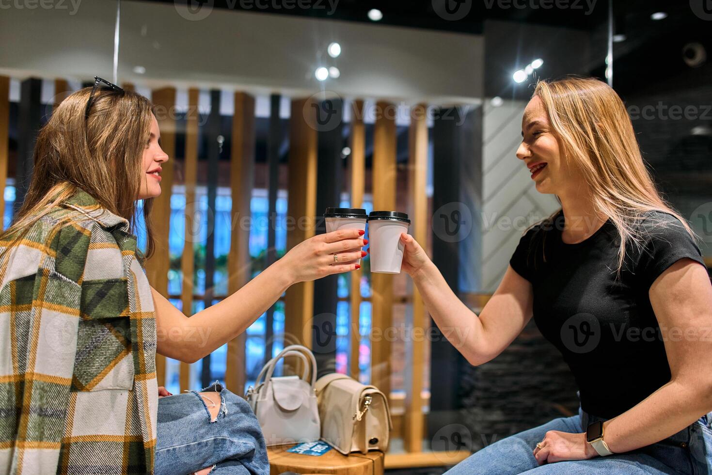 Catching Up and Caffeinating. Two Friends Unwind After a Long Day with Coffee and Conversation photo