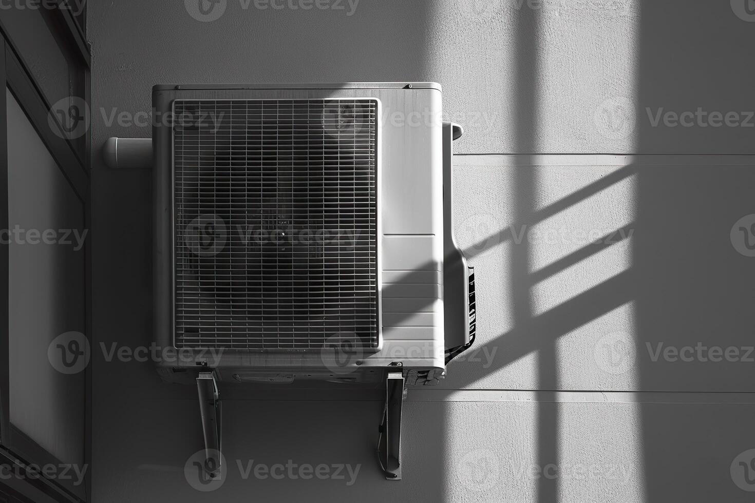 A row of air conditioners are on a roof photo