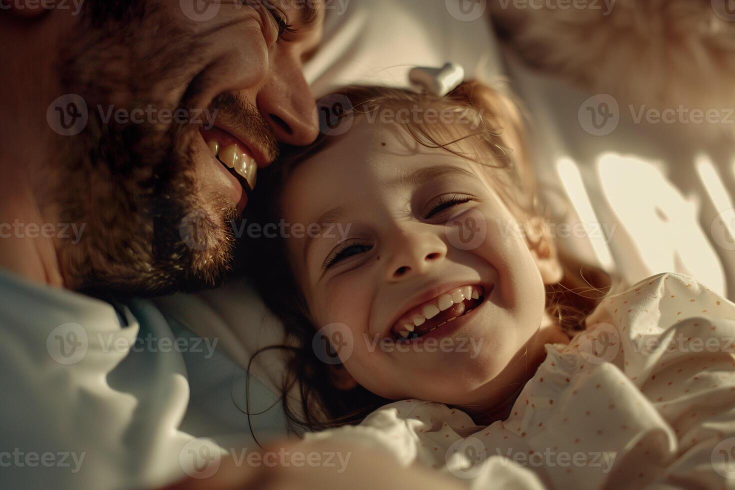 A man and a little girl are cuddling and smiling photo