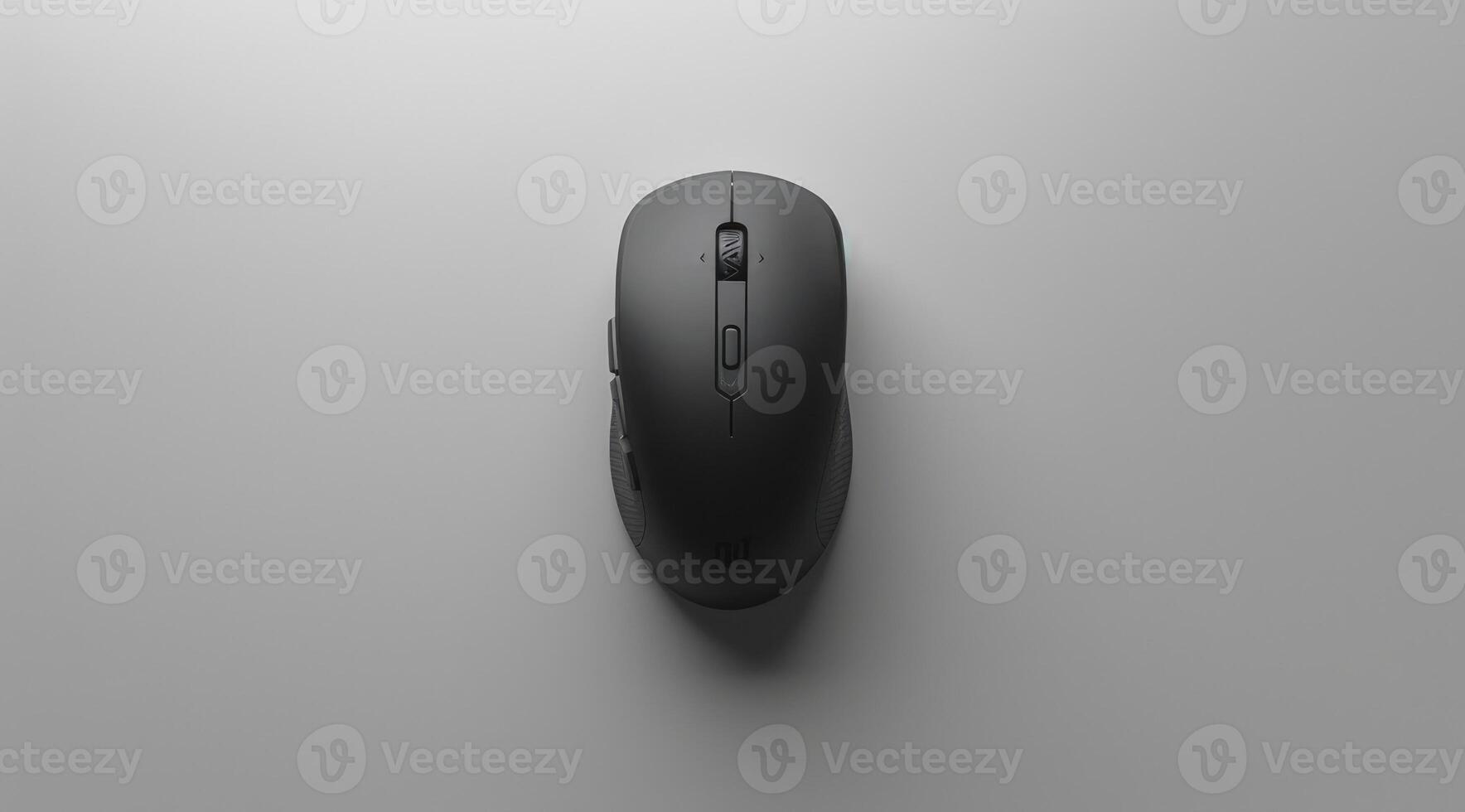 Image of a sleek, black mouse placed centrally on a minimalist grey surface. The design emphasizes simplicity and functionality, appealing to modern aesthetics. photo