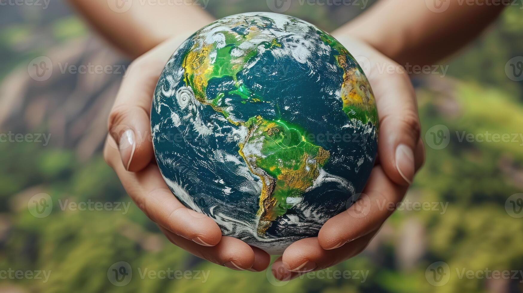 A close-up image of a persons hands holding a miniature globe, symbolizing the delicate nature of our planet photo