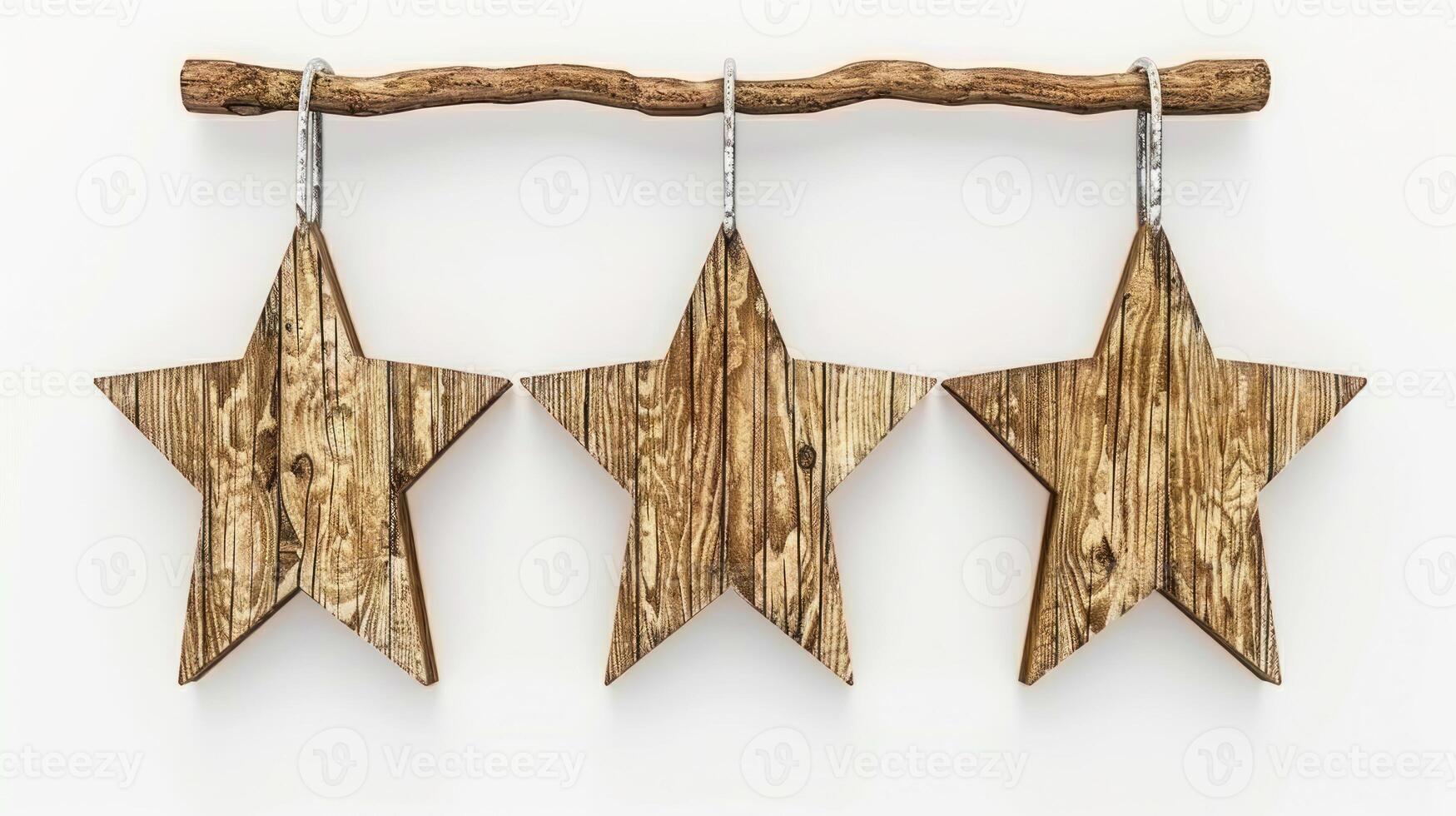Three wooden stars hang from a branch, a rustic and simple decoration photo