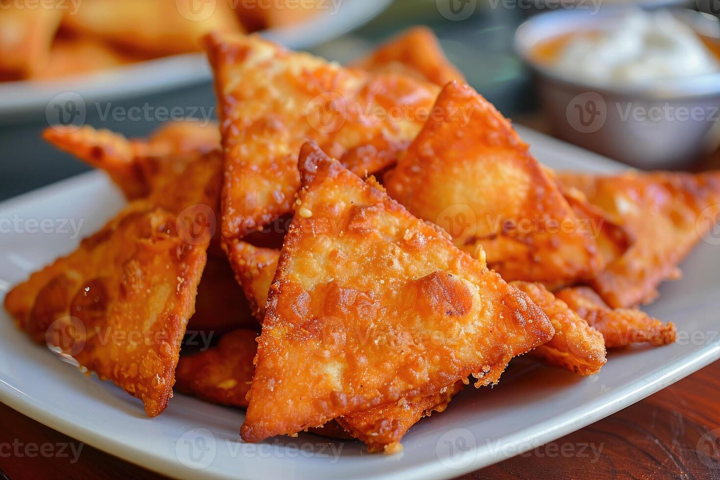 A plate full of delicious crispy samosas, traditional Indian snacks photo