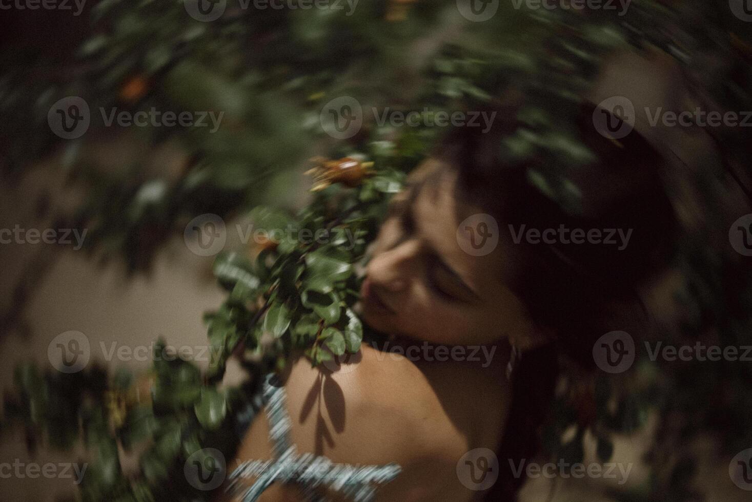 A womans portrait in nature, radiating ethereal beauty in a dreamlike, green setting photo