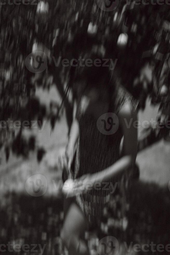 A Figure in the Blur, Collecting Fruit under the Tree in a peaceful scene of nature and harvest photo