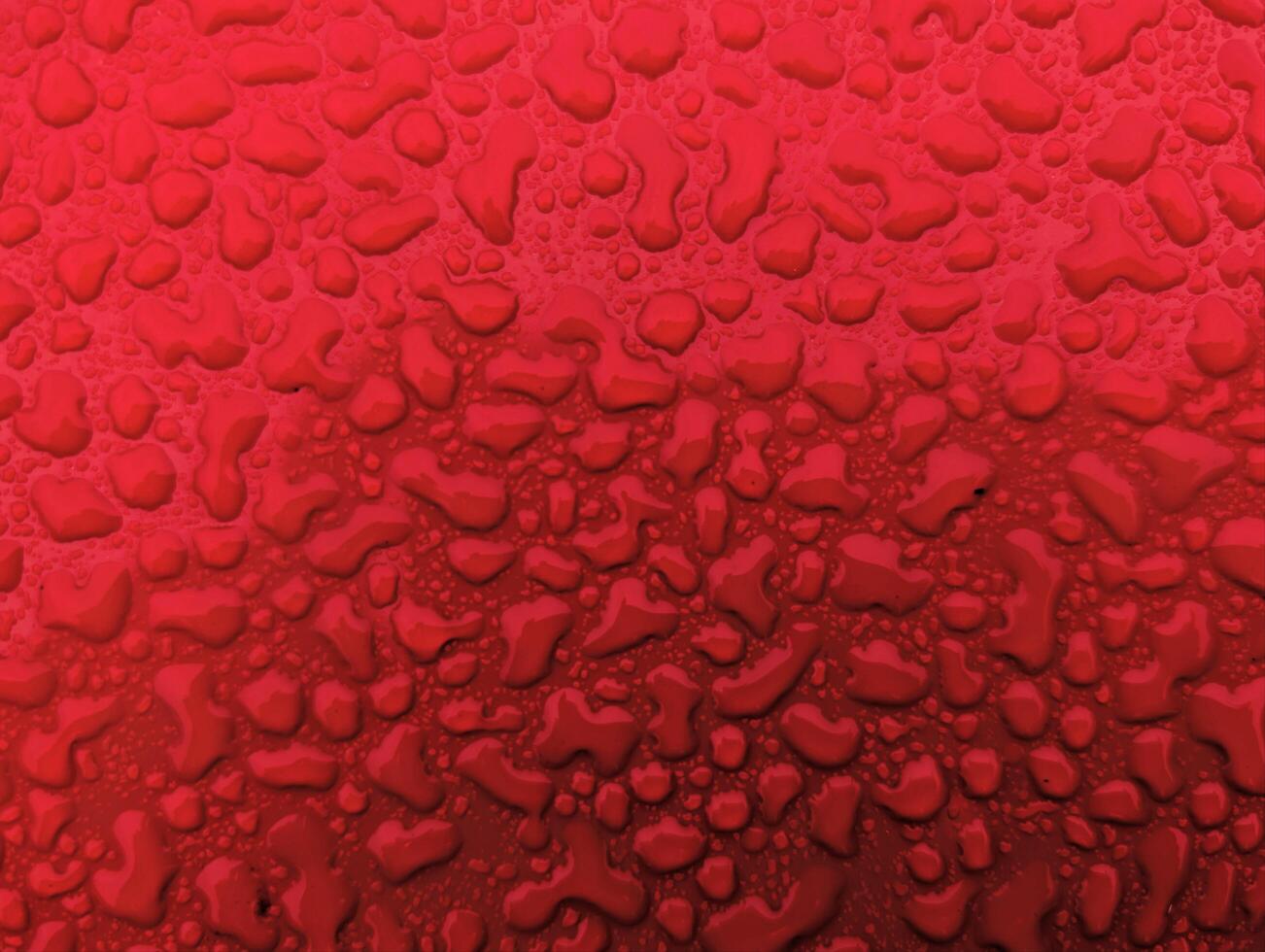 Water drops on metallic red shiny metal background, wet after rain, template, wallpaper photo