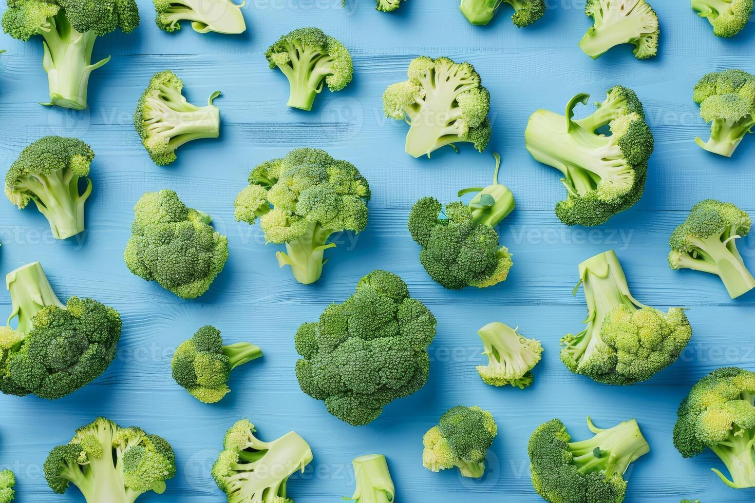 Sliced broccoli on a blue rustic wooden background photo