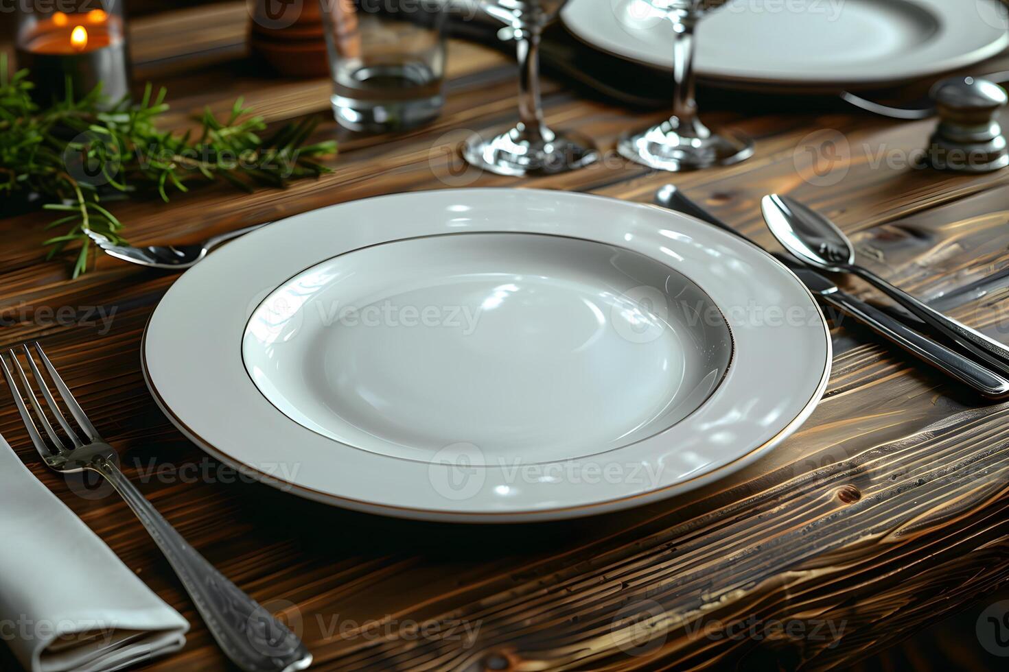 Elegant Dinner Table Setting with White Plate, Utensils, and Glasses for Fine Dining Experience photo