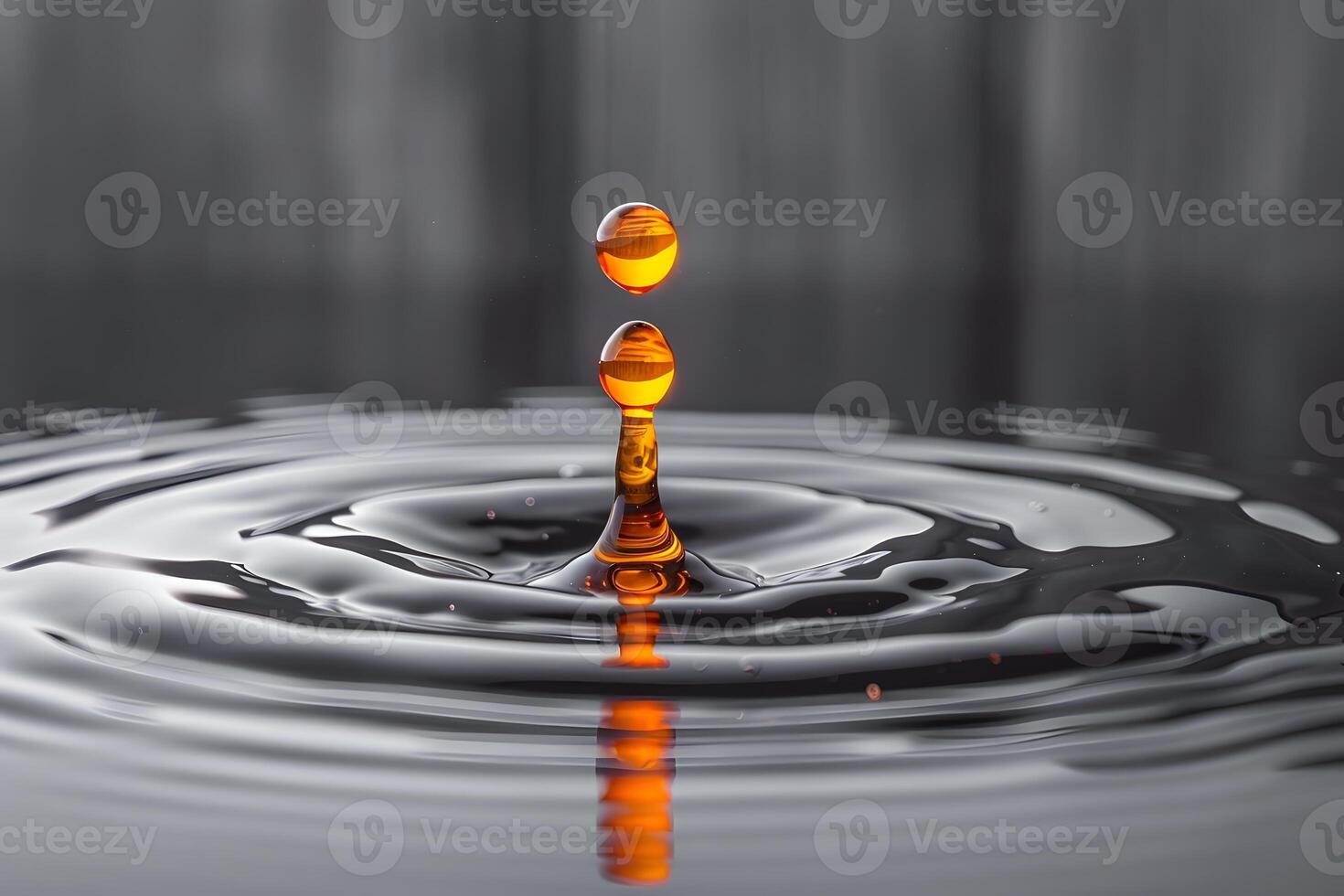 Splash of Orange Droplets on a Reflective Surface Macro Photography for Art Prints and Decor photo