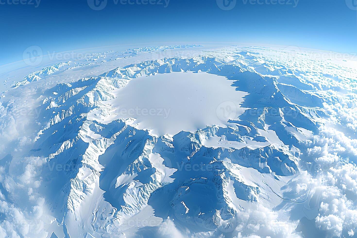 Aerial View of Massive Snow-Covered Crater Surrounded by Mountain Ranges under Clear Blue Sky photo