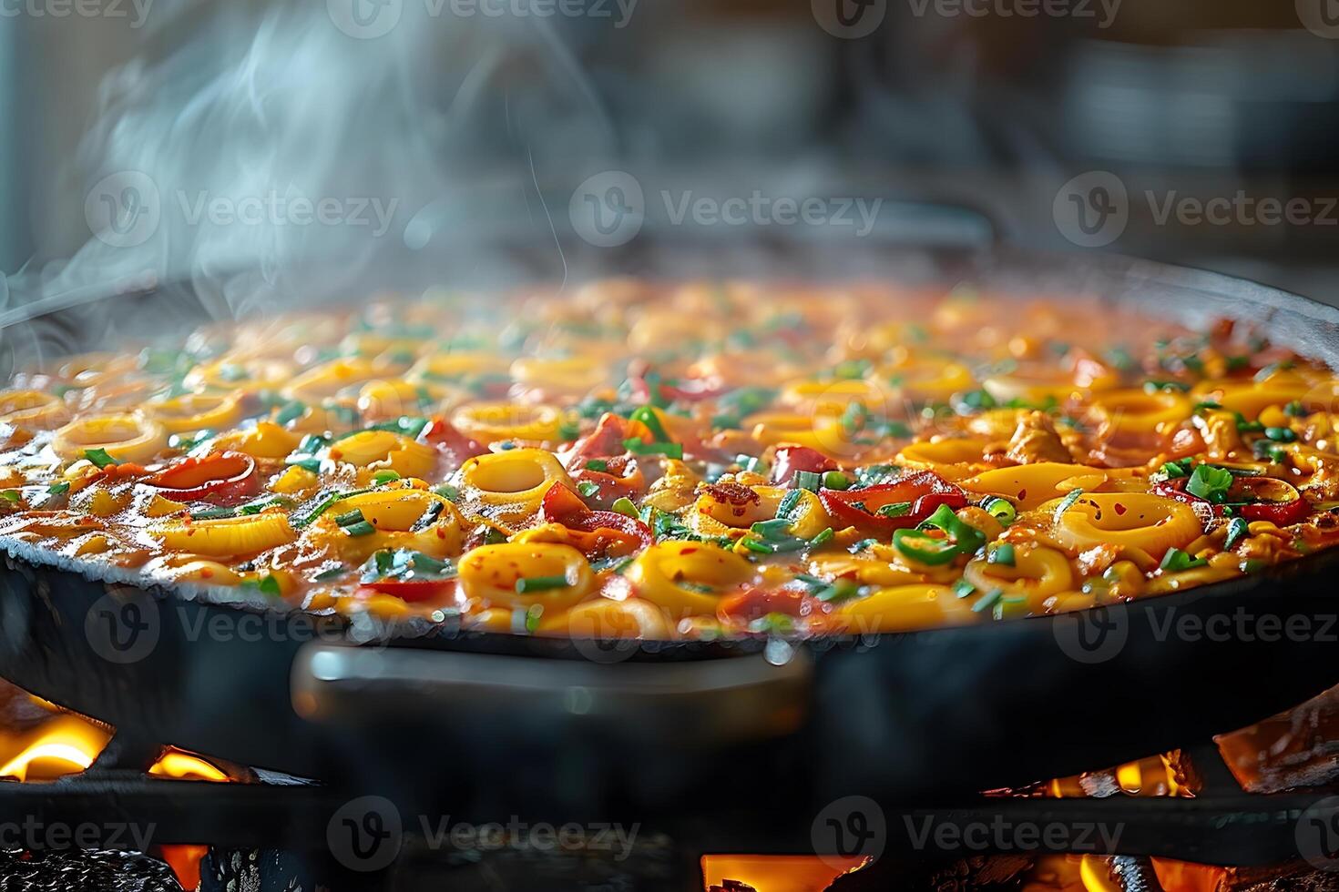 Steaming Seafood Paella on Open Fire - Traditional Spanish Cuisine for Culinary Enthusiasts photo