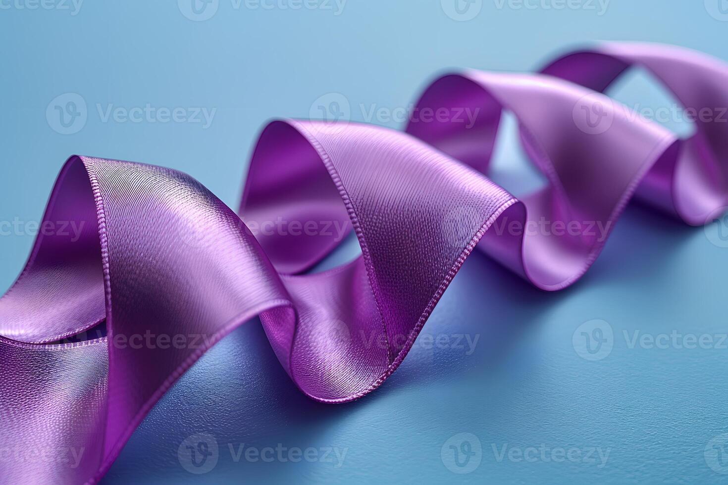 Elegant Purple Ribbon on Blue Background Decorative Design for Celebrations and Crafts photo
