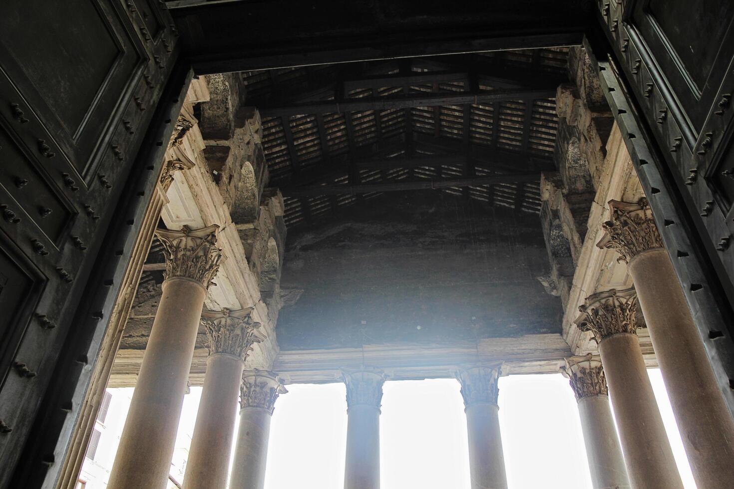 Rome, Italy - September 14 2022 - Pantheon Exit with Open Door and Beautiful Huge Columns in Rome, Italy photo