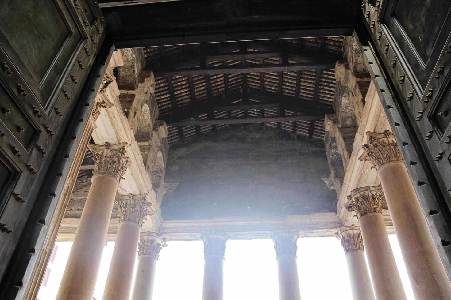 Rome, Italy - September 14 2022 - Pantheon Exit with Open Door and Beautiful Huge Columns in Rome, Italy photo