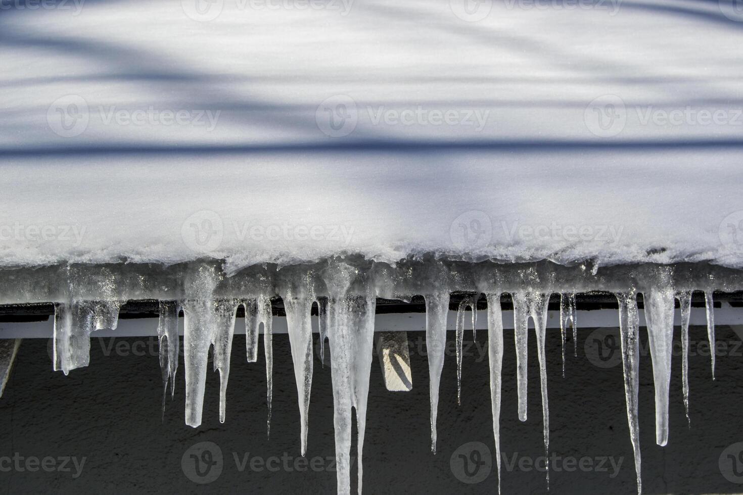 Icicles Hanging from a Rooftop photo