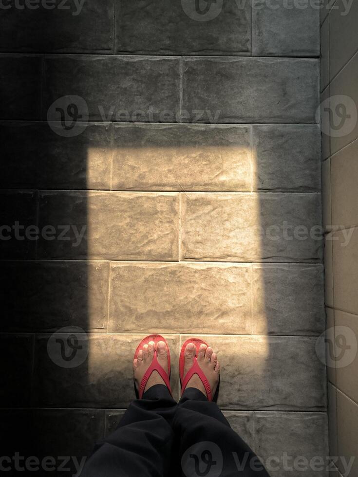 Tiles with natural rock textures under the sun light through the window photo