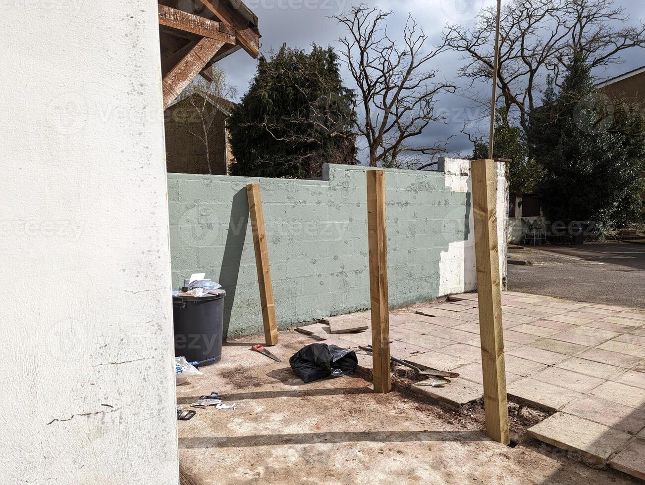 Patio in the process of a fence installation photo