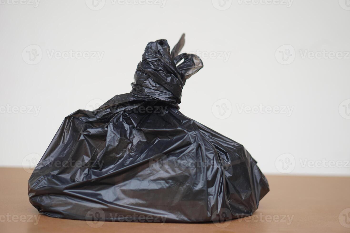 Black garbage bag, prepared for take away rubbish. Concept,rubbish, waste management. Keep in garbage bag and fastenly tied before throwing for sanitary and hygien. photo