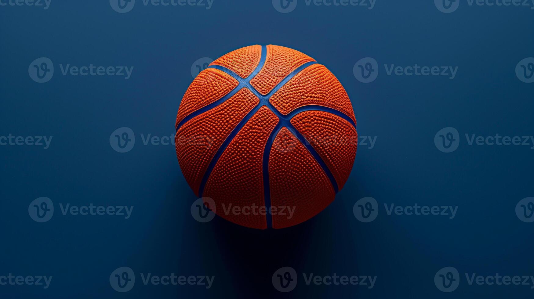 Orange basketball isolated on a deep blue background, detailed view textured. photo