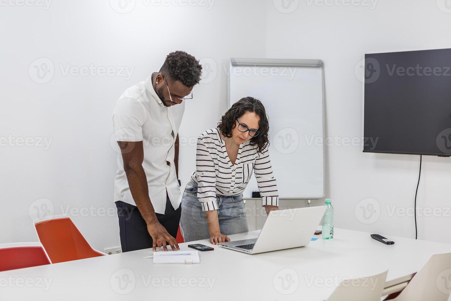 Two Colleagues Working on a Project in a Modern Office photo