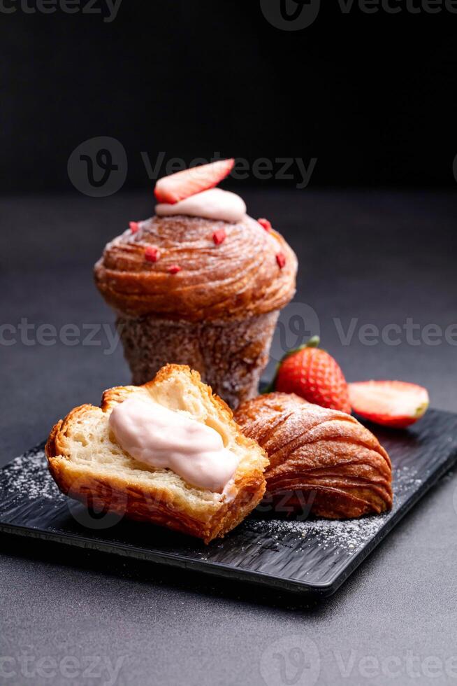 Strawberry Meringue Muffins Waffles with bread, vanilla cream and fork served on board isolated on dark background side view of baked cafe food photo