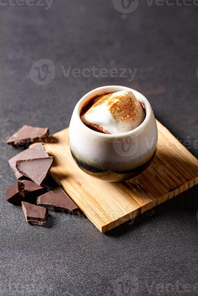 cacao tofu cup served on board isolated on dark background side view of baked cafe food photo