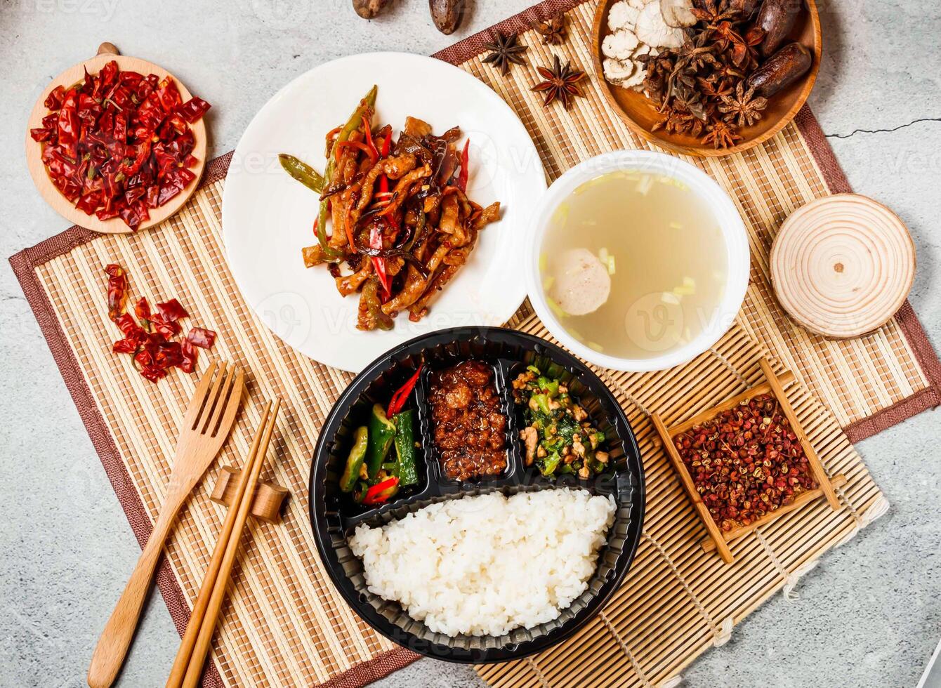 Fish flavored shredded pork set with white rice, soup red chilli, chopsticks and fork served in pot isolated on background side view of taiwanese food photo