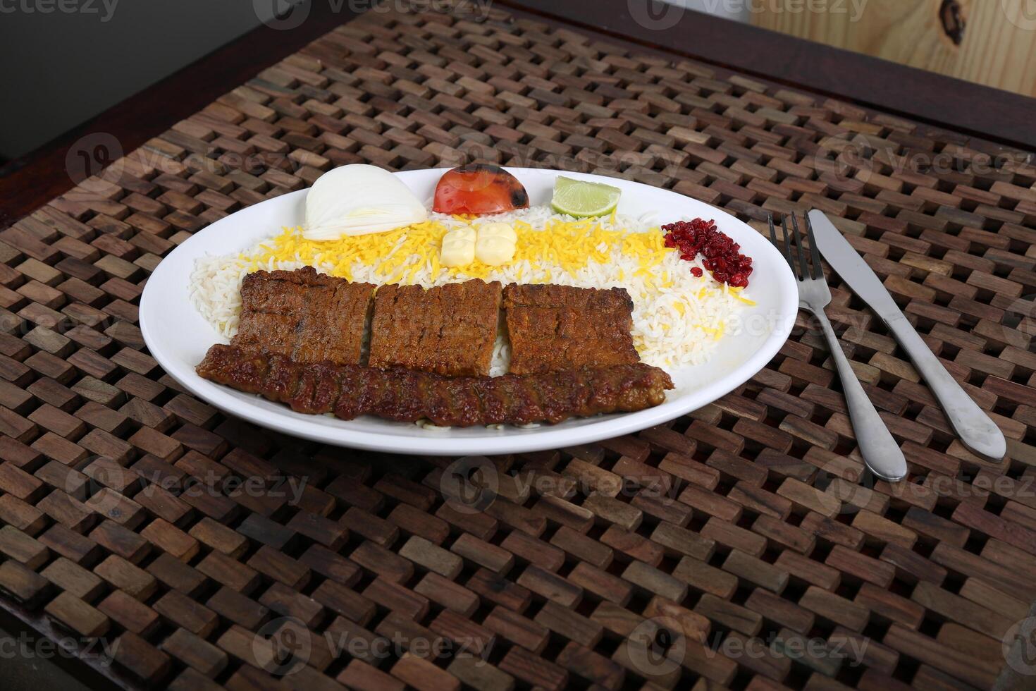 Chelo Kabab Koobideh or Kubideh served in a dish isolated on table side view of middle east food photo