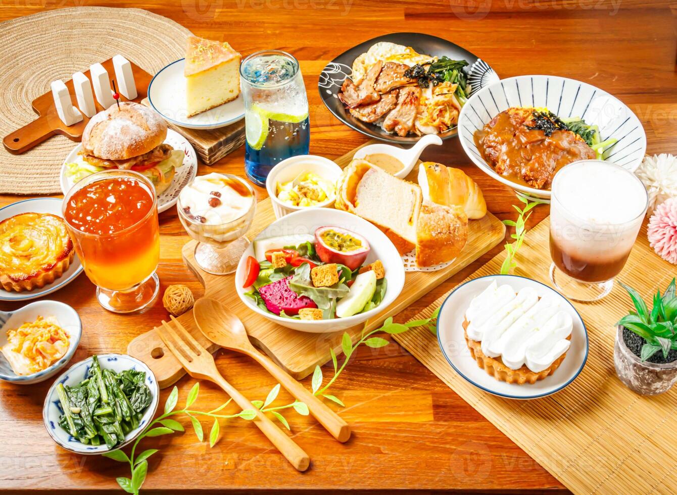 Vegetable and Fruit Salad, Lemon Cake and Tofu Pudding, lemon and Apple Pie, Curry Pork Chop Rice, BBQ rice, Roasted Pork Burger, Golden pomelo tea, Elderberry Sparkling Drink, Cocoa Ole served photo