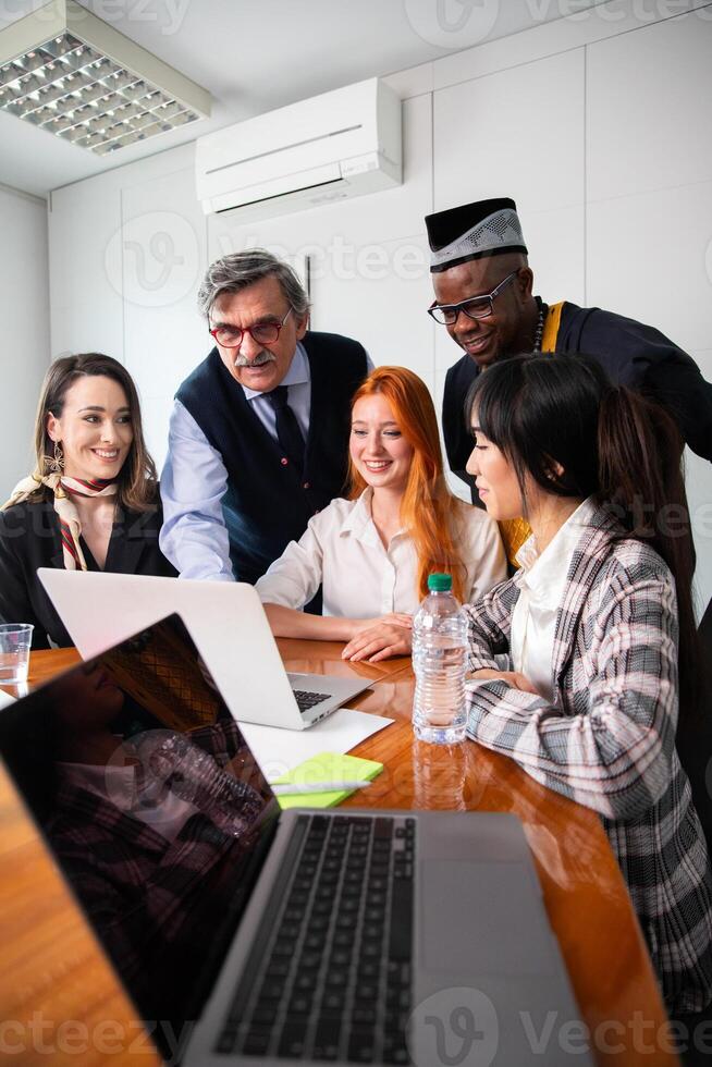 Business meeting between business partners, multi ethnic group with different ages, vertical photo