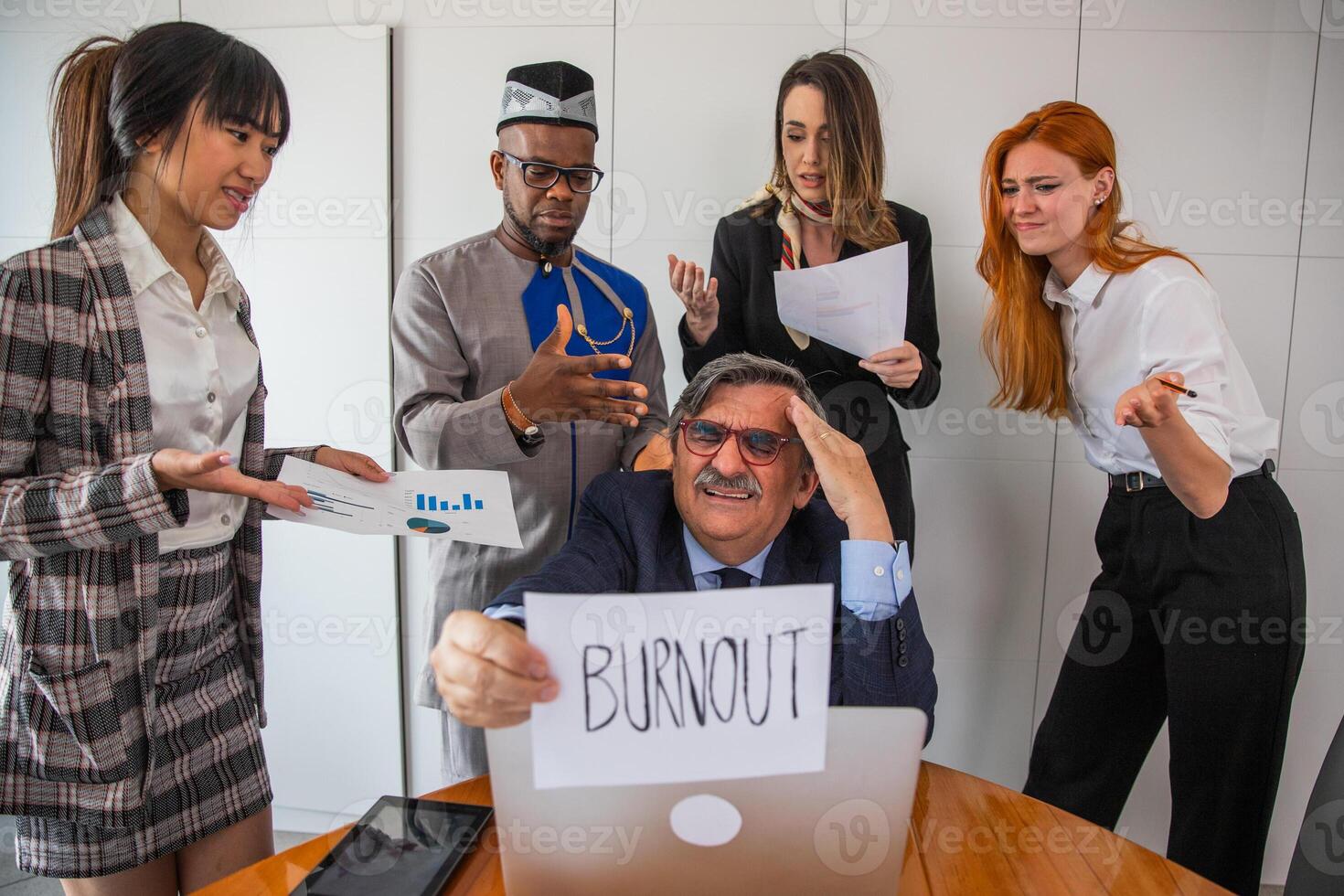 A businessman is stressed because his colleagues mistreat him and he has too much work photo