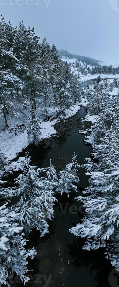 Amazing Cinematic Aerial View On Freezing River. Aerial View Flight Above Frozen Creek Scenic View Of Nature photo
