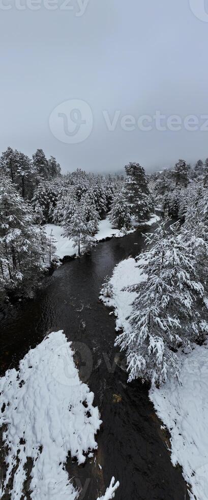 Amazing Cinematic Aerial View On Freezing River. Aerial View Flight Above Frozen Creek Scenic View Of Nature photo