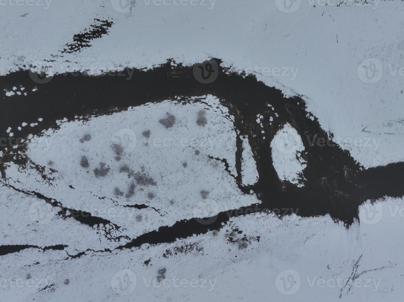 Amazing Cinematic Aerial View On Freezing River. Aerial View Flight Above Frozen Creek Scenic View Of Nature photo